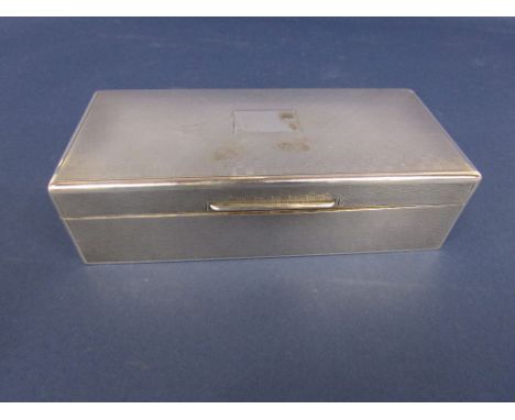 1920s engine turned silver cedar lined cigarette box, with chequer board decoration, the hinged lid enclosing a segmented int