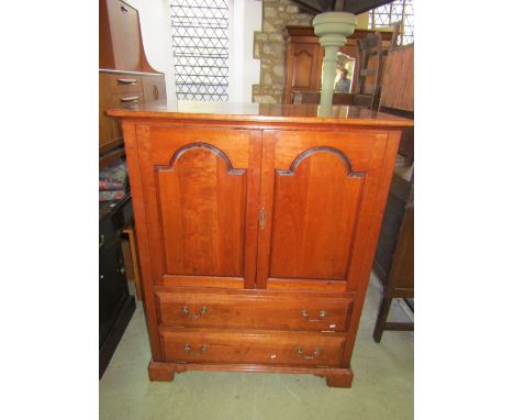 A substantial good quality cherrywood side cupboard partially enclosed by a pair of fielded stepped arched panelled doors ove