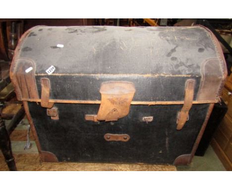 A Victorian fibre and stitched leather reinforced basket lined domed top travelling trunk, together with one other smaller ex