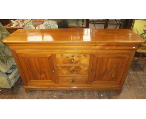 19th century cherry wood buffet or sideboard, with central tower of three drawers flanked by two panelled cupboards raised on