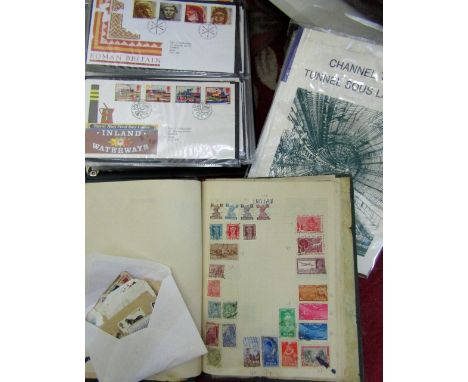 An album containing a quantity of British and worldwide stamps from mid 20th century onwards, an envelope containing assorted