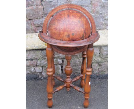 A contemporary reproduction floor standing terrestrial globe and stand, together with a nautical theme outsized table or floo