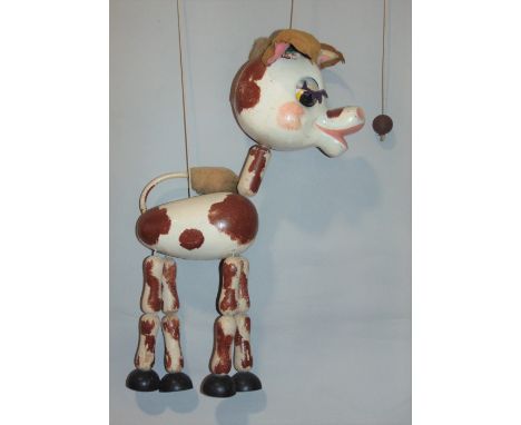 A  Pelham large size string puppet: Brown and white Cow in painted wood, with strings and springs and felt ears, 20" high