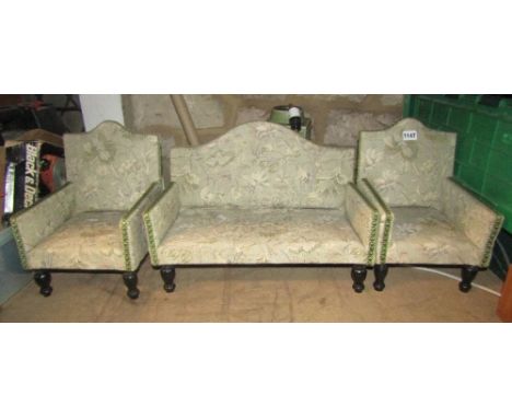 A miniature/dolls size three piece upholstered camel back suite comprising a two seat sofa and a pair of matching armchairs, 