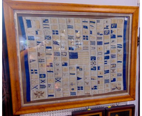 A 19th century printed cotton panel showing the standards of nations and cities, worldwide, to the centre the American ensign