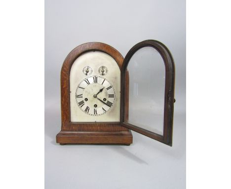 Good Westminster chime type lancet oak mantle clock with three train dial, two subsidiary dials and musical alarm movement