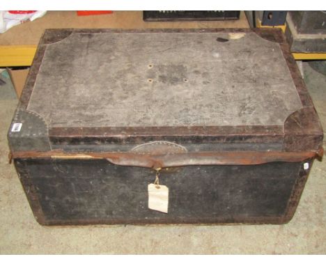 A 19th century wooden clad and reinforced trunk, with brass lock and hinged lid, label to interior, Restell &amp; Co, Manufac