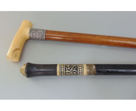 19th century ebonised sword stick, together with a Malacca shafted ivory handled walking stick with silver collar (2)