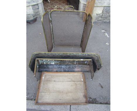 A Victorian brass fender with pierced grill and lions paw feet, 112 cm long approx, together with two further smaller example