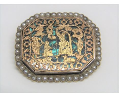 An Indian Pertabgarh brooch of octagonal form, depicting Buddistic deities and attendants upon a green enamel ground with see
