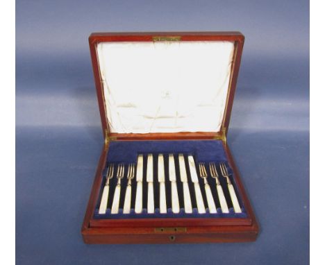Mahogany cased canteen fitted with two tiers of pearl handled silver flatware to include twelve knives and twelve forks, by M