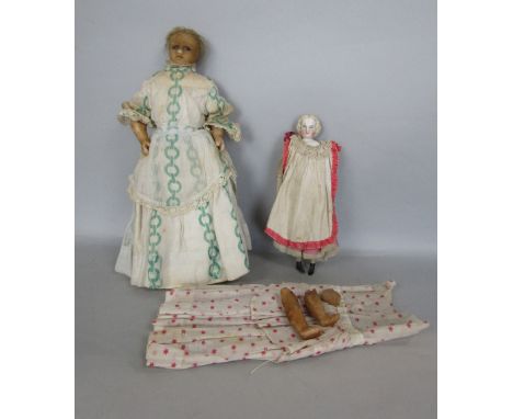 A box containing a collection of vintage dolls to include a wax headed doll and porcelain headed doll
