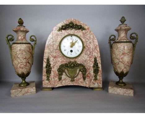 early 20th century French pink veined marble clock garniture, the lancet mantle clock with applied gilt flowering campana and