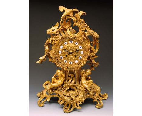 Impressive French ormolu figural mantle clock cast with cherubs mounted by an eagle with various rococo scrolls, the 13 inch 