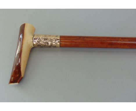 Malacca shafted walking stick with ivory type handle and embossed silver collar