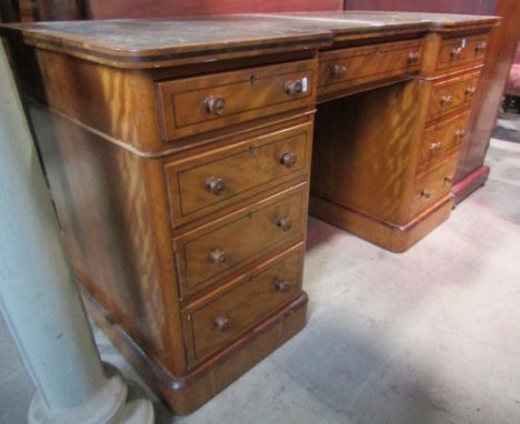 A Victorian satin birch shallow inverted break front twin pedestal writing desk, with triple inset leather panel top over an 