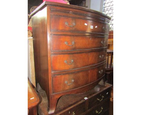 A good quality reproduction Georgian style mahogany bow fronted bedroom chest with brush slide over four long graduated drawe