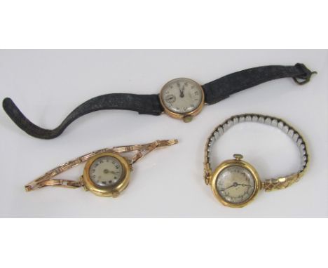 Two early 20th century 18ct lug watches, both on associated concertina straps, together with a further vintage gent's mid siz