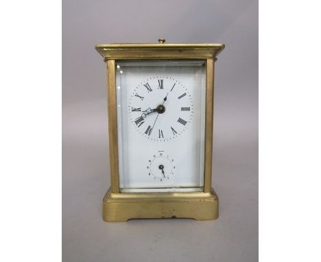 Good brass repeater carriage clock, the enamel dial with subsidiary dial with bevelled glass, striking on a bell, 15cm high