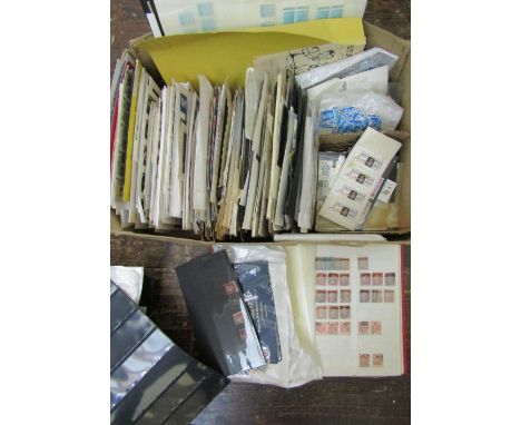 A box containing a large quantity of unsorted loose British and worldwide stamps including a stock sheet containing a number 