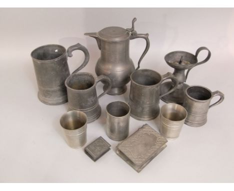 A mixed collection of antique and later pewter to include three tankards, a lidded baluster jug, a cricket chamber stick and 