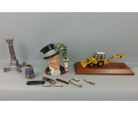 A box of interesting items to include a silver plated candlestick in the form of Nelsons column, a faceted cloisonne vase, a 