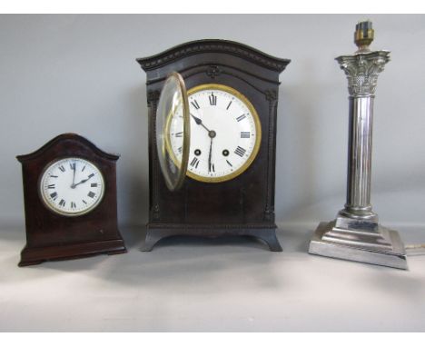 Early 20th century mahogany veneered two train mantle clock, striking on a gong, the arched case with rope twist garlands, to