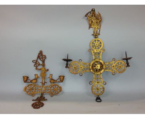 Two similar continental religious pierced brass hanging candelabra, mounted by biblical figures with pierced detail, the larg