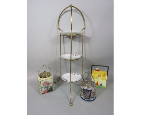 Brass framed three tiered cake stand, fitted with porcelain plates with floral spray together with three vintage porcelain bi