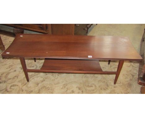 A 1960s Afromosia two tier coffee table by Richard Hornby, of rectangular form with moulded outline, shaped ends and raised o