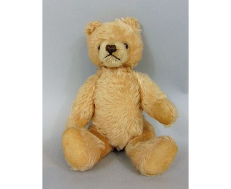 A Steiff bear circ.1966, with off white body, button to ear, 25cm high