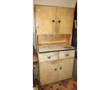 A 1950s/60s floorstanding steel kitchen cabinet enclosed by an arrangement of four drawers and two drawers and enamel slide/w