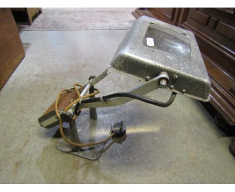An industrial adjustable counter balance work or reading lamp, with cast alloy base