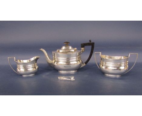 Late Victorian silver three piece boat shaped tea service, comprising teapot, milk jug and sucrier, maker JD WD, Sheffield 18