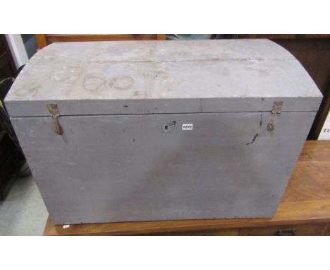 A pine domed top trunk with painted finish and side carrying handles