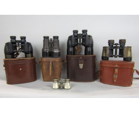 A box containing a collection of vintage binoculars and opera glasses 