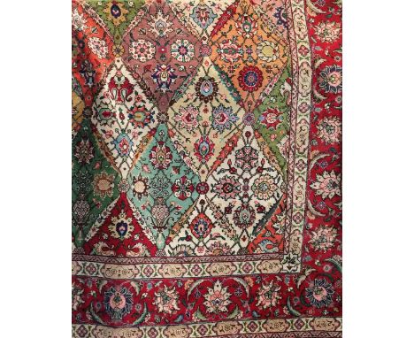 An Tabriz style wool carpet, good quality, with multi medallion field with floral "panelled garden" design within alternating