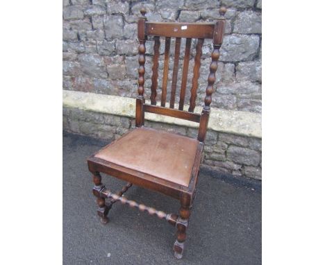 Set of four 1920s oak rail back dining chairs, with drop in seats and bobbin turnings