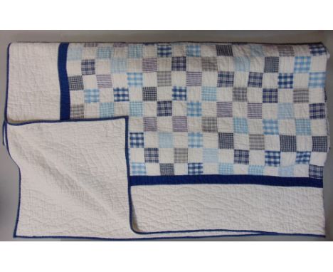 Machine stitched patchwork quilt with blue, white and checked fabric, 240 x 220cm approx together with an IKEA rug 133 x 195c