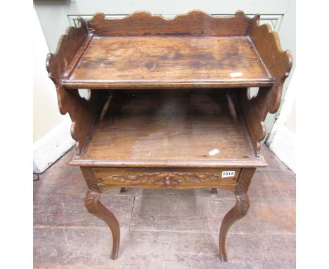 Early 19th century oak side table with frieze drawer raised on four shaped supports, with shaped and pierced gallery supporti