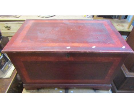 A 19th century pine blanket box, with stained and painted finish, hinged lid enclosing a candle box to interior, raised on br
