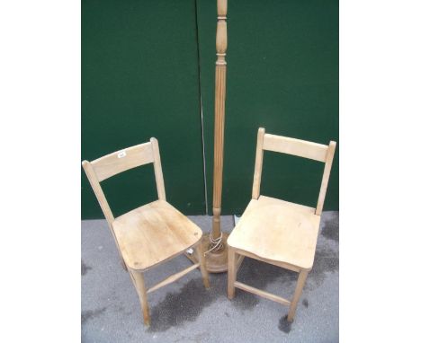 Two beech kitchen chairs and a stripped beech standard lamp 