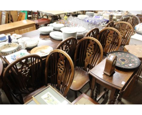 A set of eight elm seated stick and wheelback dining chairs 