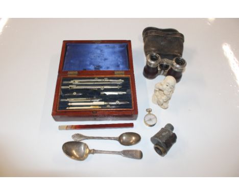 A mahogany case of drawing instruments; a resin figure; two silver spoons; a compass; a piece of agate; a monocular and opera