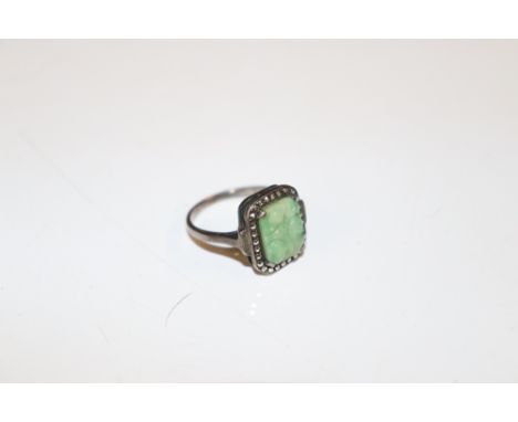 A silver ring set with jade coloured panel, ring size N/O, total weight approx. 3.5gms 