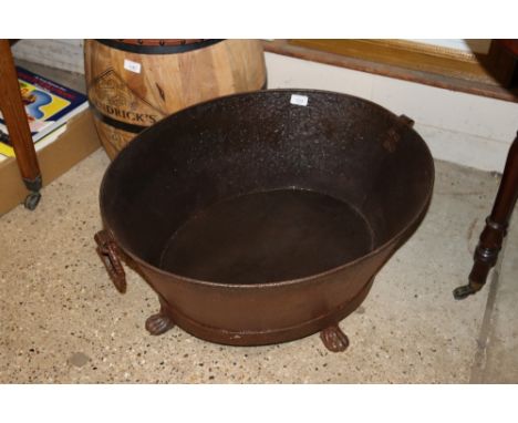 A large oval iron planter