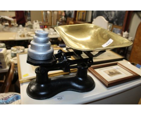 A set of cast iron and brass scales with weights 