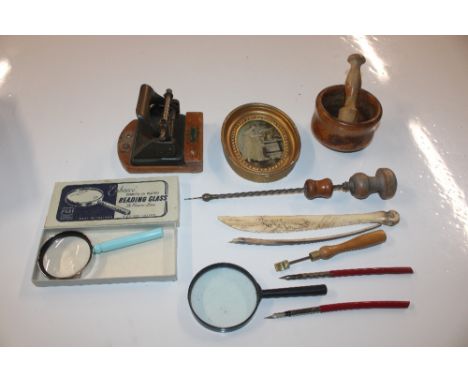 A late 19th Century scrimshaw antler paper knife with reindeer figure on sledges; a vintage screwdriver; a hole punch; magnif