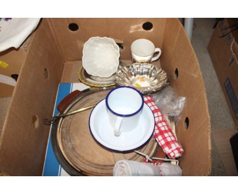 A box containing a bread board, toasting fork, jelly mould etc. 
