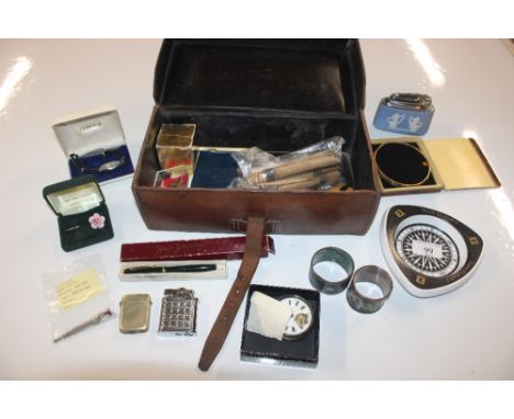 A leather box and contents including silver pocket watch AF, coins, a Dinkie pen, Wedgwood jasperware table lighter, Christma